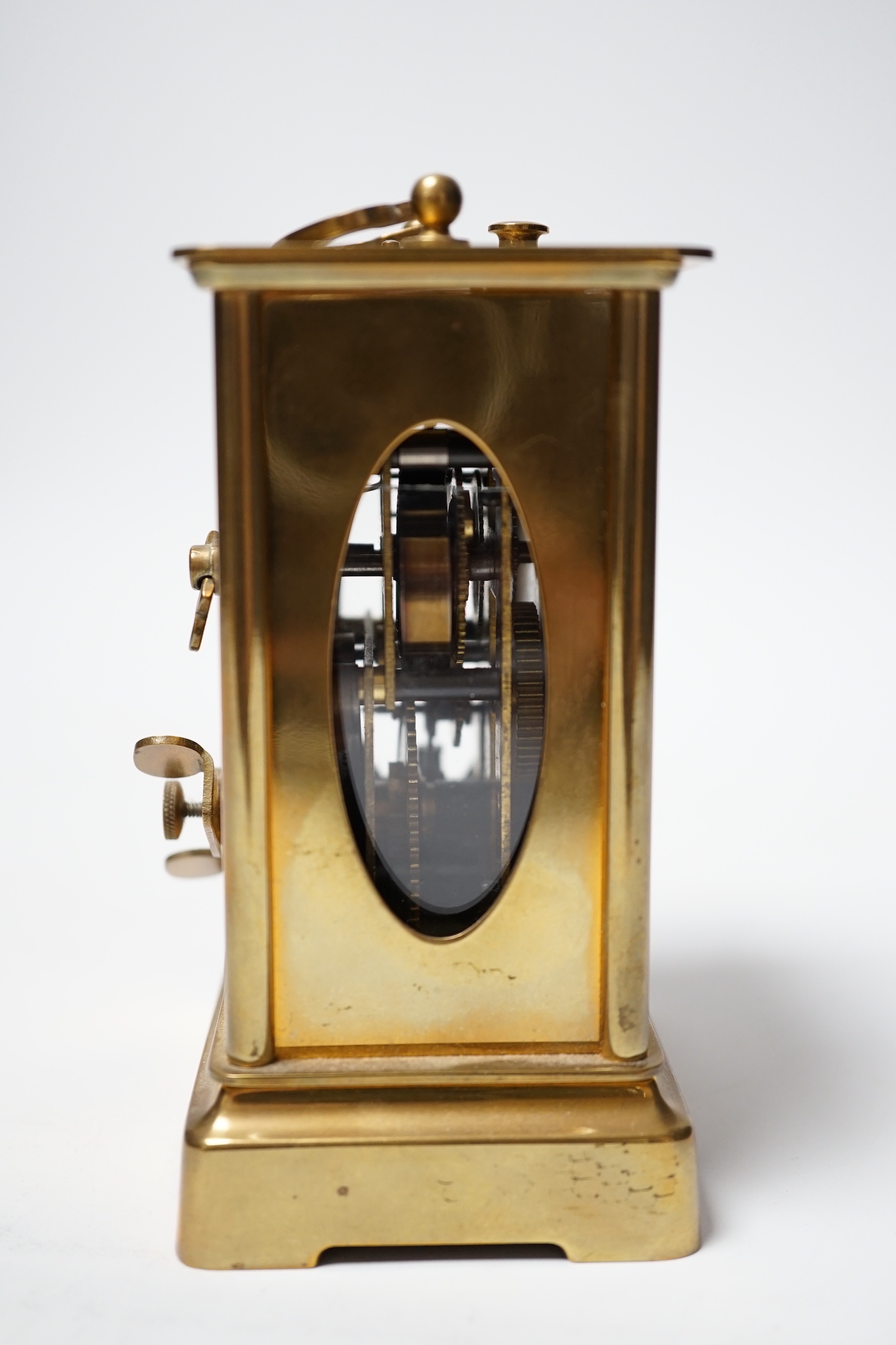 Two brass carriage timepieces; one with an alarm dial, the other in a drum case, tallest 11.5cm